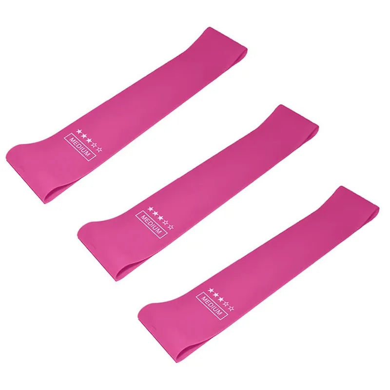 Set of three pink medium resistance exercise bands for fitness and physical therapy