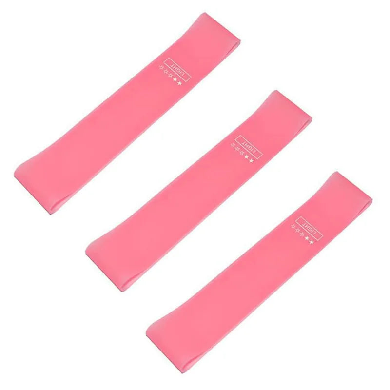 Set of three pink resistance loop bands for fitness and exercise