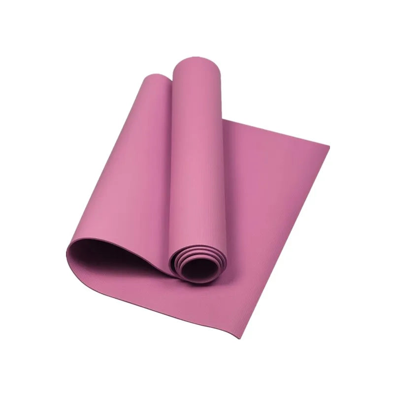 Pink yoga mat rolled and unrolled on a white background, fitness accessory